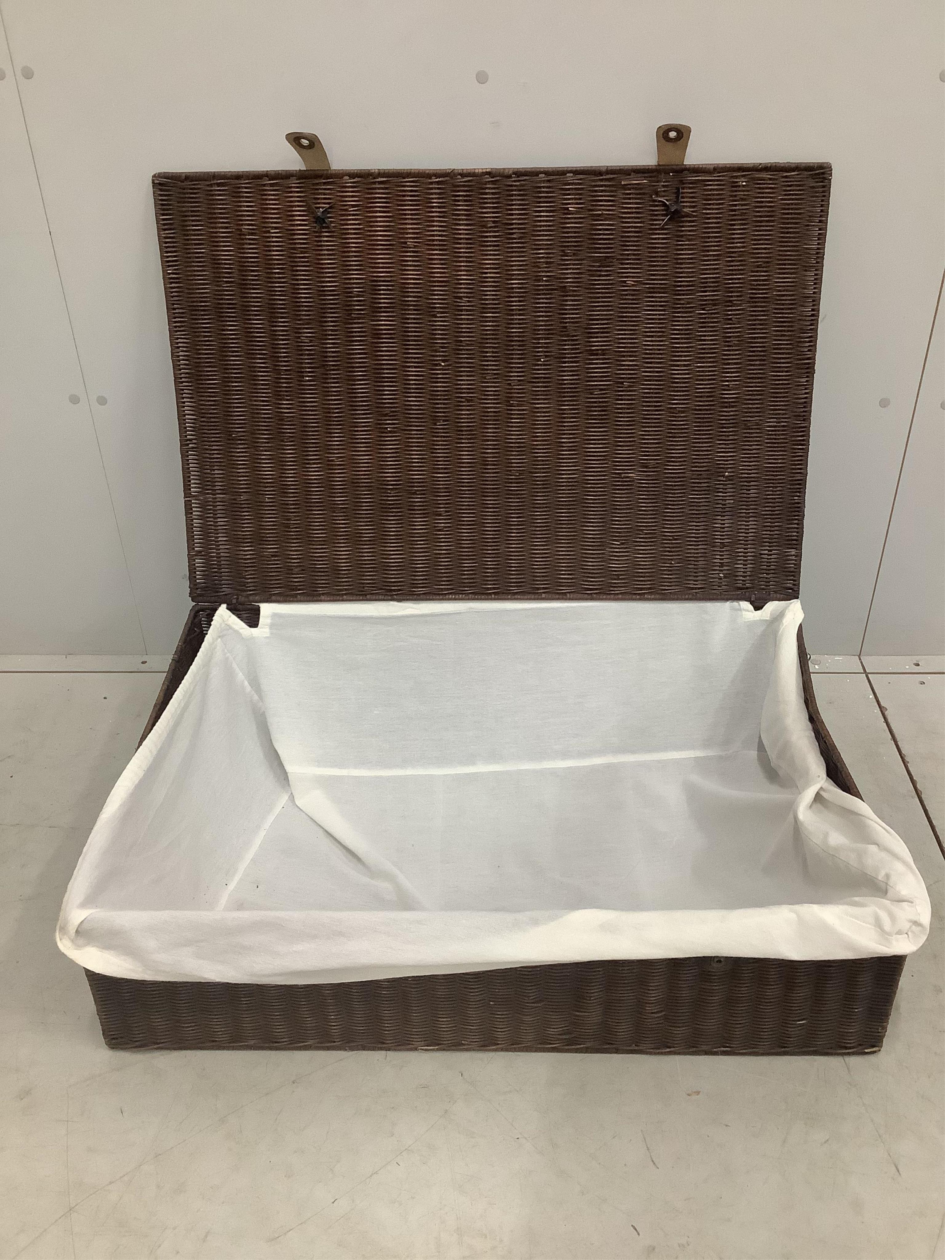 Twelve OKA wicker baskets, each width 88cm, depth 58cm, height 26cm. Condition - fair